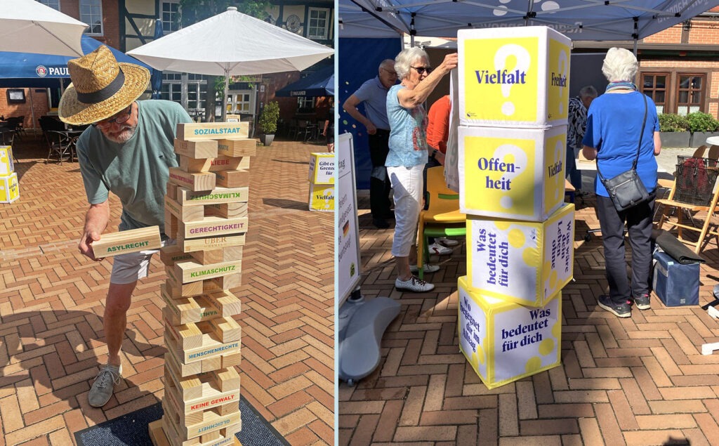 Spielerischer Einstieg: Beim Jenga-Spiel oder beim Würfeln lässt es sich leicht über demokratische Werte wie Vielfalt, Gerechtigkeit und Offenheit diskutieren.